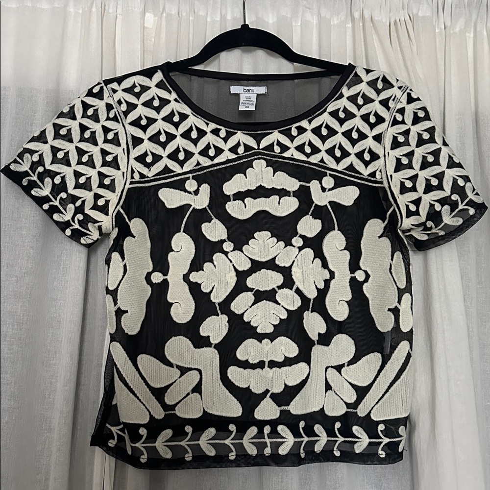 Bar III embroidered sheer top with shirt sleeves.